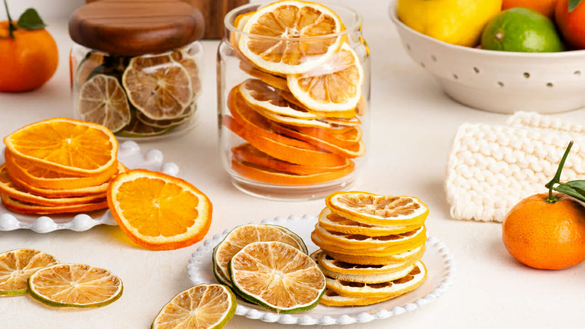 Dried citrus, lemons, oranges, limes on a bright, styled table decor. Hosting made easy with garnishes and fruit leathers