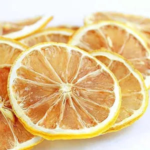Dried lemon slices for cocktails and crafts. Stacked together on a white background